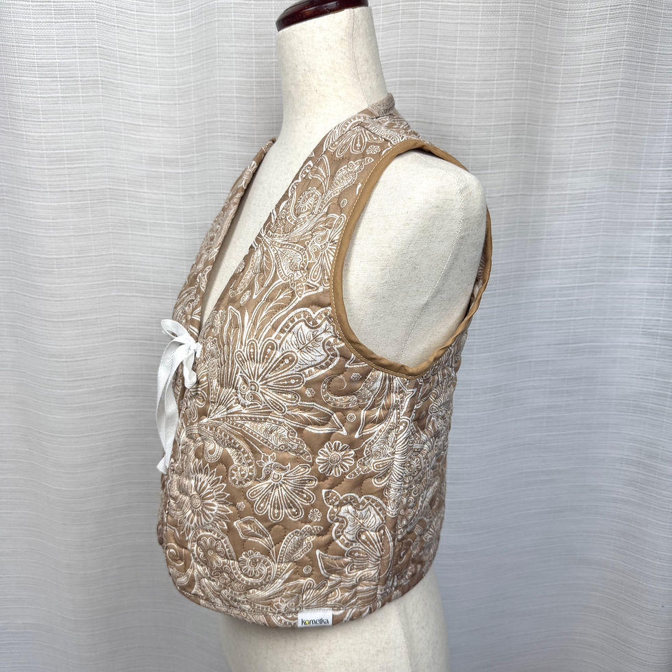 Thumbnail: Side angle of reversible pillowcase vest showing texture and binding
