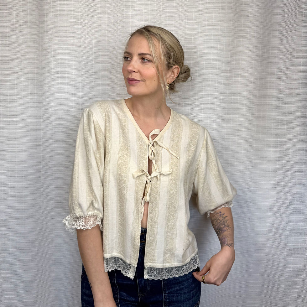 pcycled lace-trim blouse with tie-front closures, front view on model (Size L)