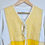 Thumbnail: Close-up of tie front and linen colorblock fabric with yellow and white panels.