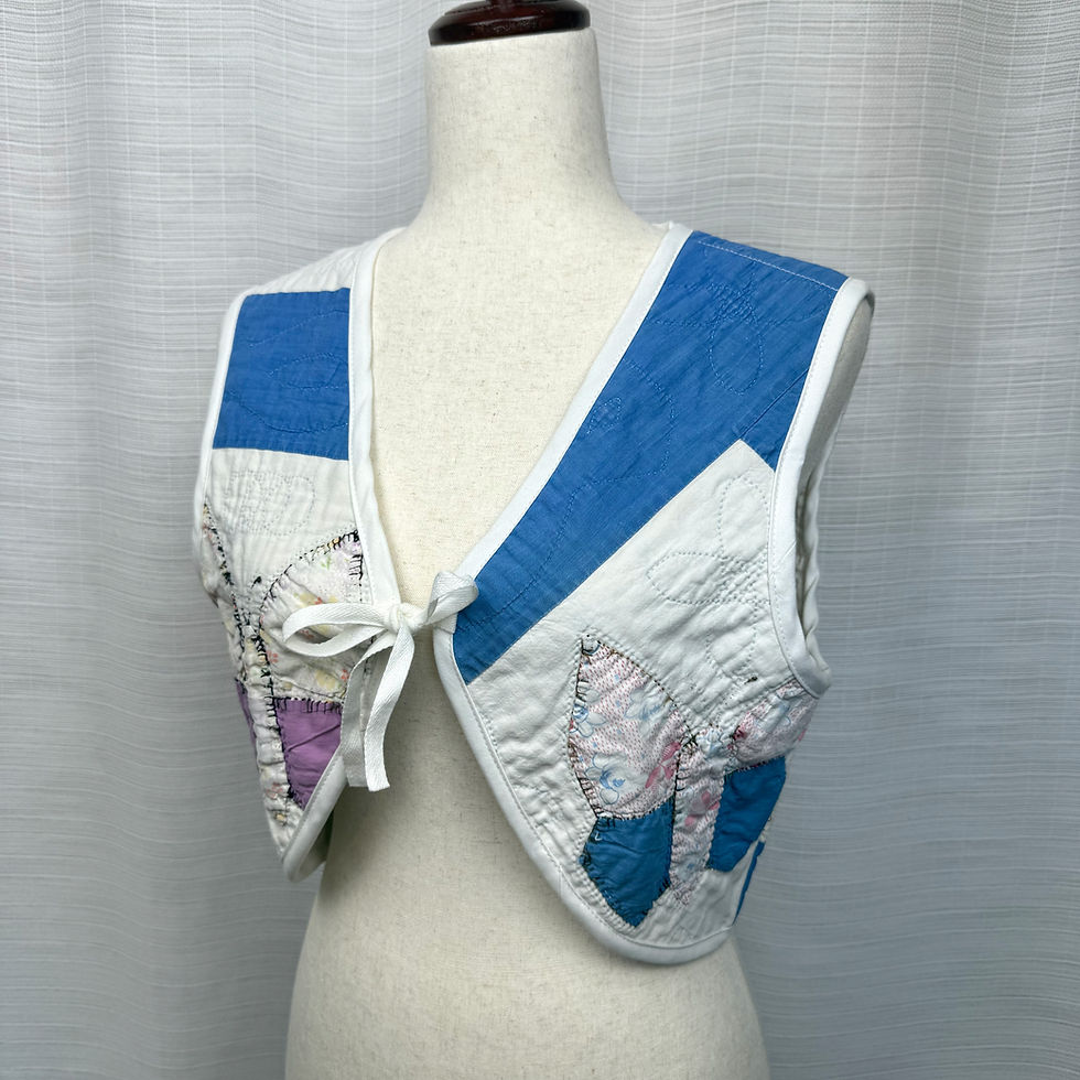 Thumbnail: Front view of reversible upcycled vintage quilt vest