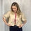 Thumbnail: Upcycled embroidered beige blouse with tie-front closures, front view on model