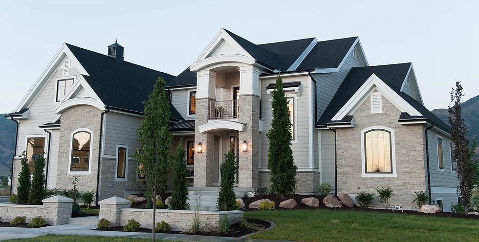 Black windows, gray house, gray exterior stone, black gutters