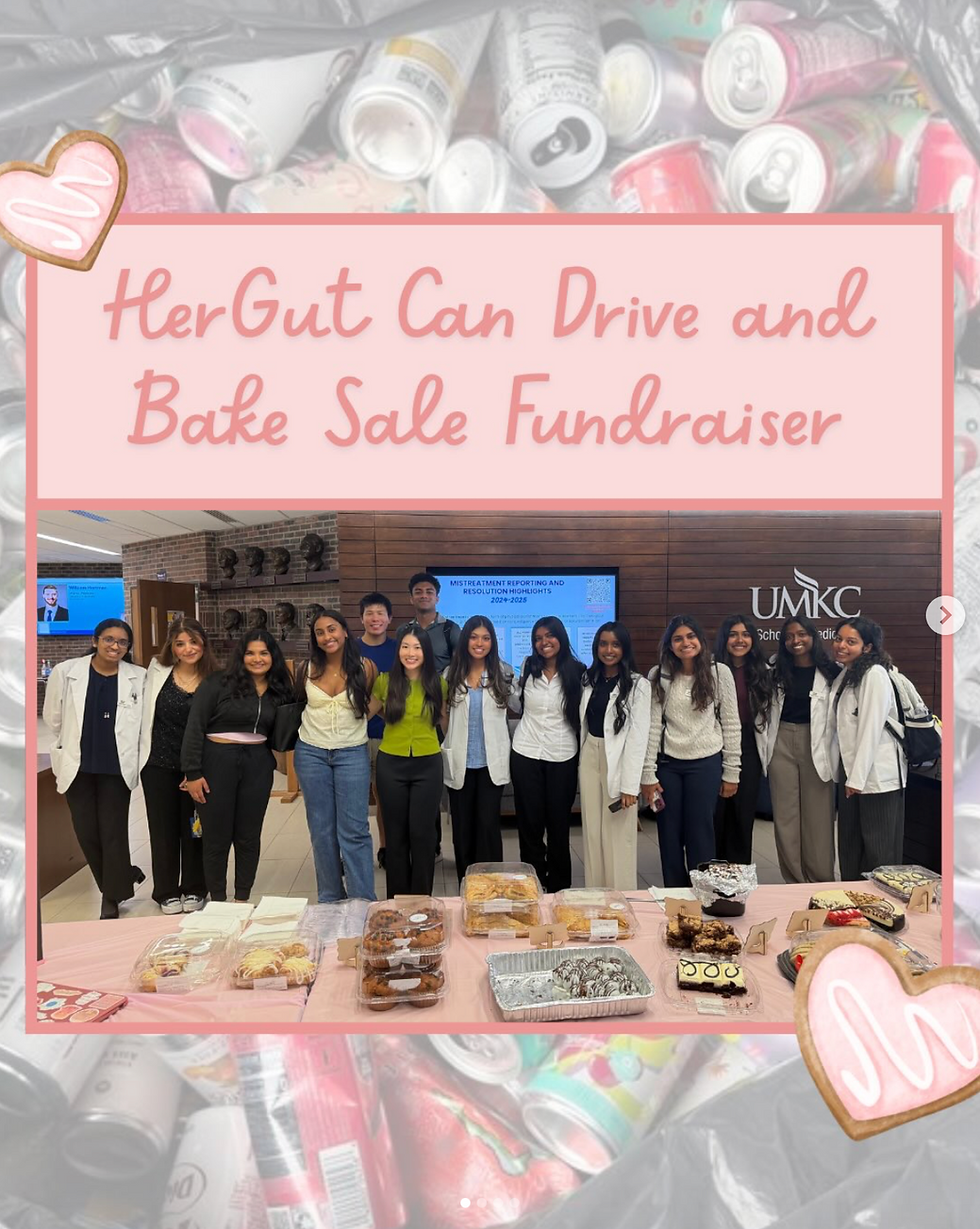 Group photo of volunteers behind bake sale table