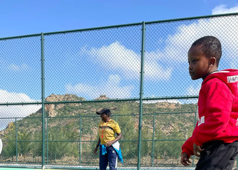 Children playing and interacting on the outdoor playground at Fadhili International School