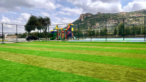  Green artificial turf play field at Fadhili International School used for sports and outdoor activities
