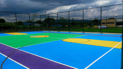 Basketball court at Fadhili International School surrounded by safe, open environment