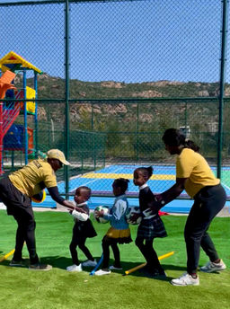 Children playing and interacting on the outdoor playground at Fadhili International School