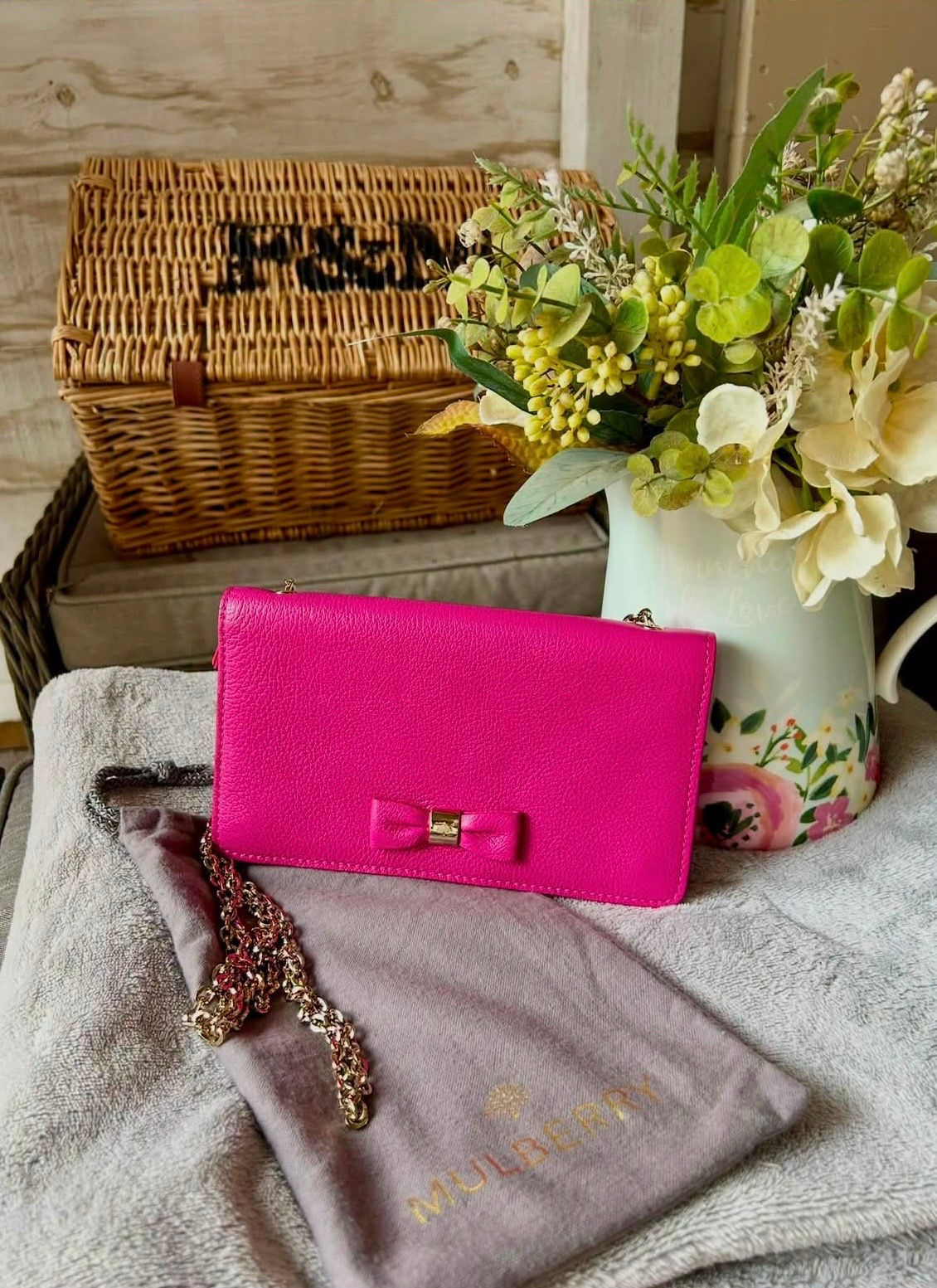 Mulberry pink bow evening bag in soft grain leather, with detachable gold chain.