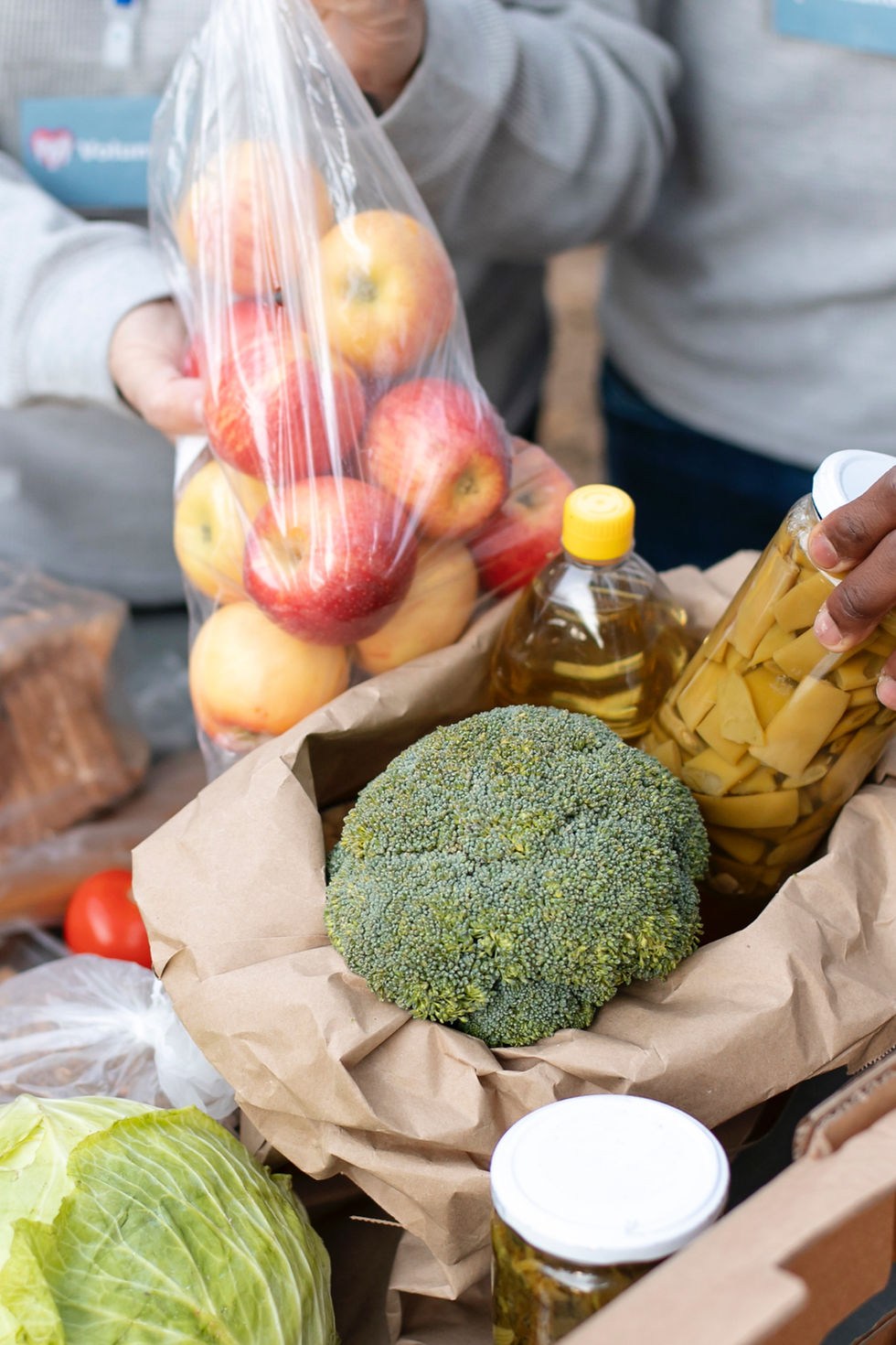 close-up-volunteers-collecting-food-donations.jpg