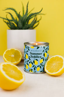 Lemon candle product photography with yellow background and lemons