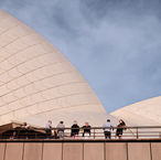 Photo series titled "Sweet Dreams" featuring a curated photography set that contrasts architectural lines, coastal views, and candid figures against soft sky tones and warm lighting. Locations: Australia & Indonesia.