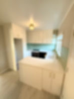 Renovated bathroom with white vanity and pendant lighting by Sorted Home Solutions