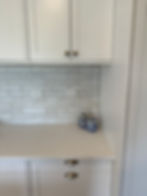 Close-up of bathroom vanity basin and tiled splashback by Sorted Home Solutions