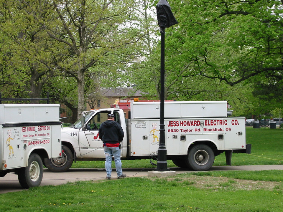 Worker installing lighting throughout the park