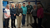 Friends gathered to award the city forester