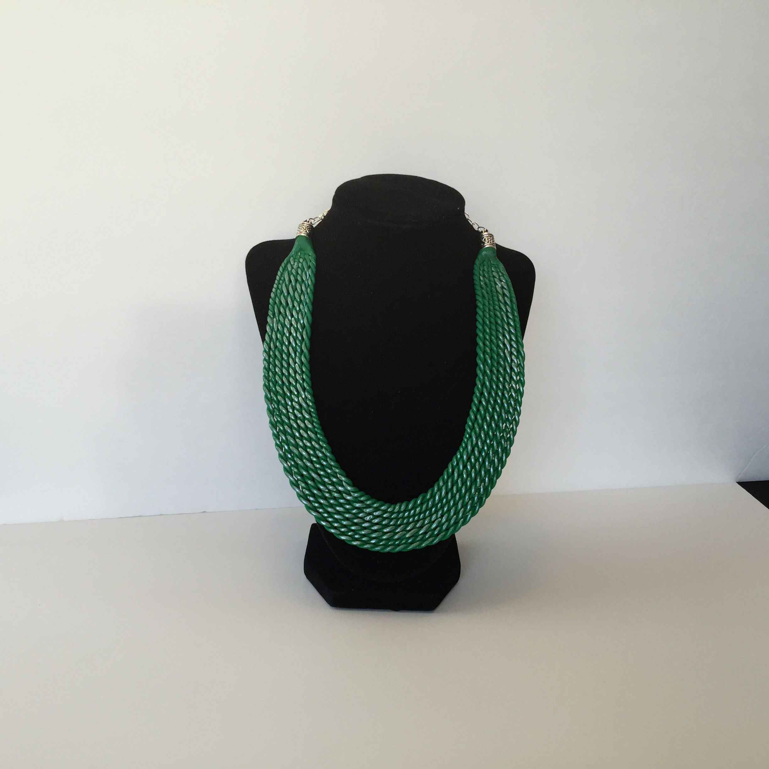 Green clay bib silver accents