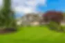 custom-built-house-luxury-nicely-trimmed-designed-front-yard-lawn-residential-neighborhood