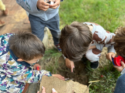 Montessori children examining nature