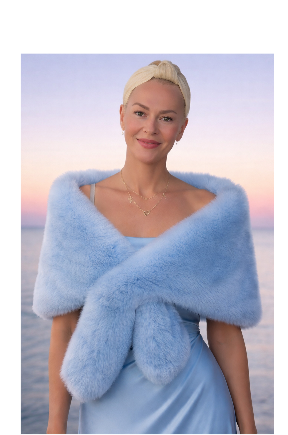 Blonde woman in light blue dress and faux fur shawl