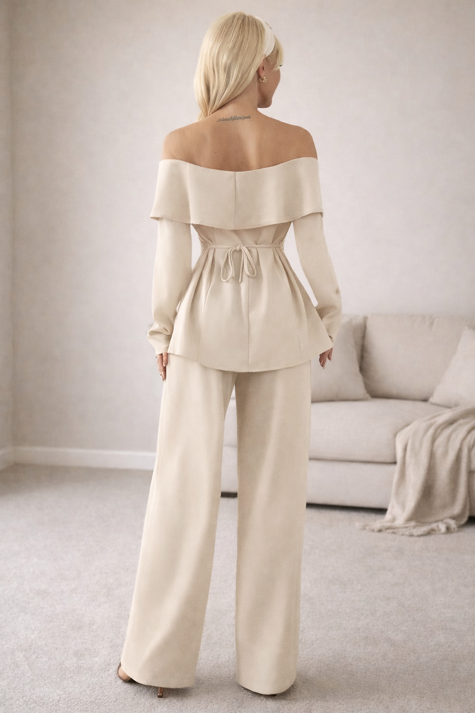Elegant off-shoulder top with tie-waist and wide-leg trousers