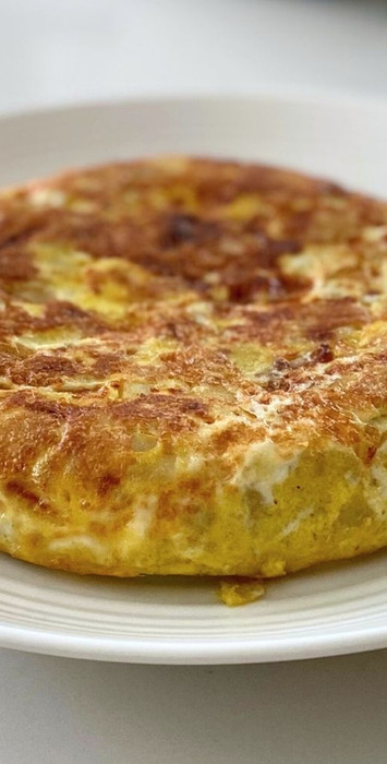 Spanish tortilla on a white plate 
