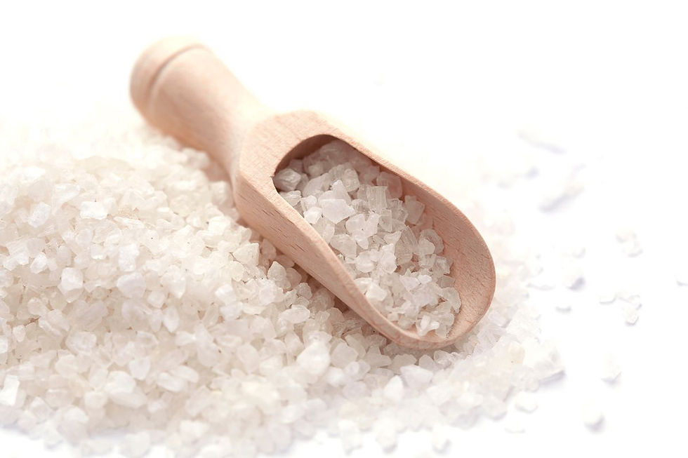 Rock salt with a wooden scoop