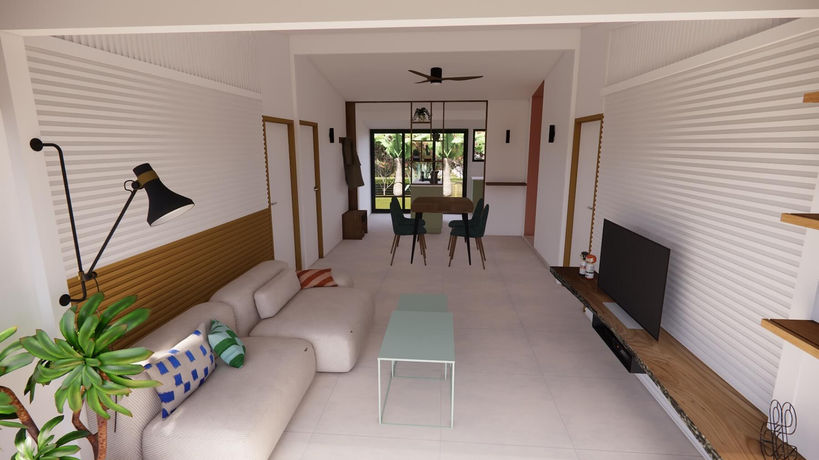 Pièce de vie ouverte avec salon lumineux et salle à manger donnant sur jardin – rénovation case Tomi
