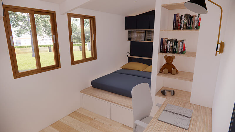 Chambre d’enfant avec lit surélevé et bureau intégré dans une case Tomi rénovée à Sainte-Suzanne, optimisation d’espace La Réunion