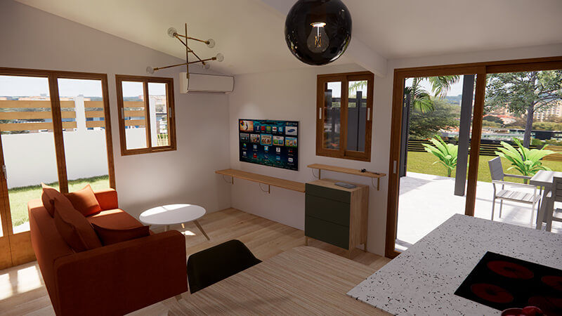 Salon avec canapé terracotta et accès terrasse dans une case Tomi rénovée à Sainte-Suzanne (974), projet rénovation architecte d’intérieur