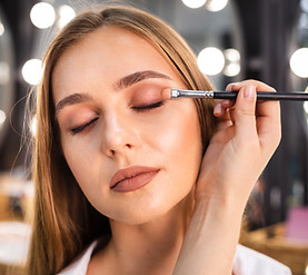 close-up-make-up-artist-applying-eyeshadow-woman-with-brush.jpg