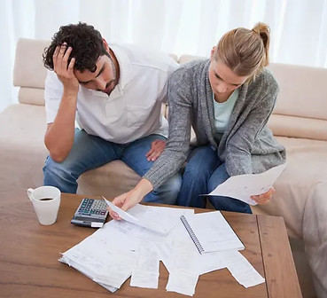 depositphotos_11205825-stock-photo-depressed-couple-doing-their-accounting.jpg
