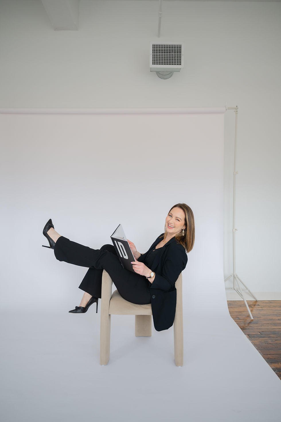 Barbara Caruso of AvantGarde Design sitting and smiling