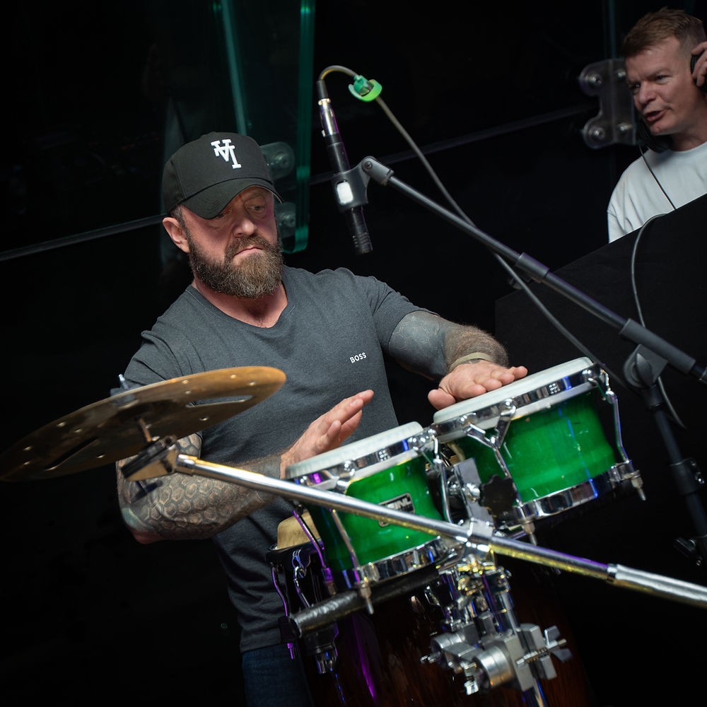 Musician playing bongo drums