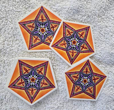Four vibrant pentagon mandala stickers