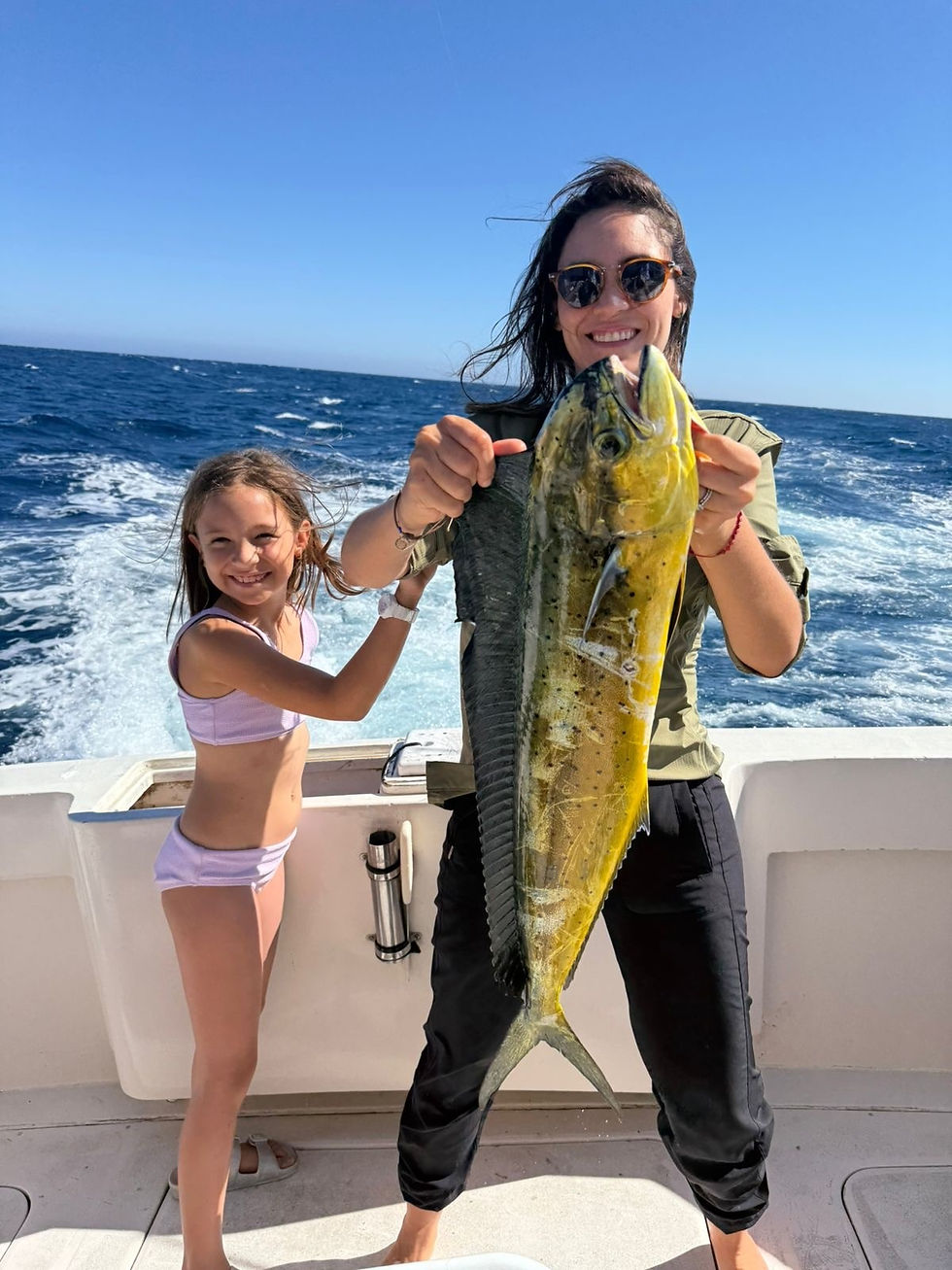 Charter guests of Top Anglers Sportfishing Charters display a dorado - one of four fish they caught in Cabo San Lucas for their super grand slam.