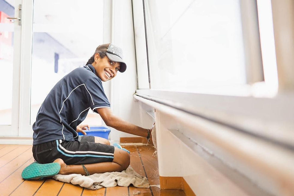 Annette cleaning the floors onboard the YWAM vessel