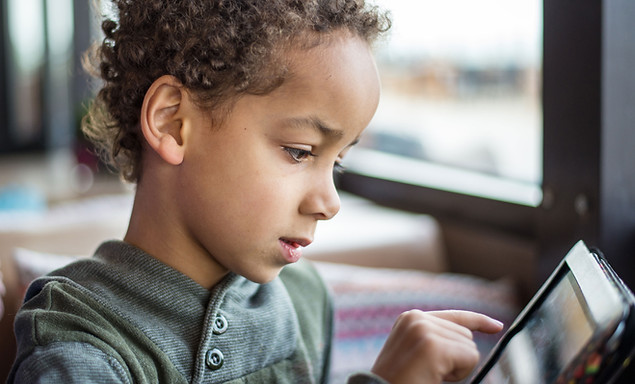 Boy Reading Tablet