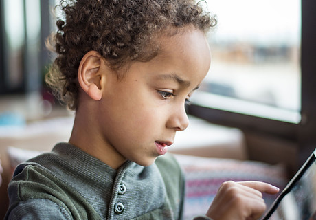 Boy Reading Tablet