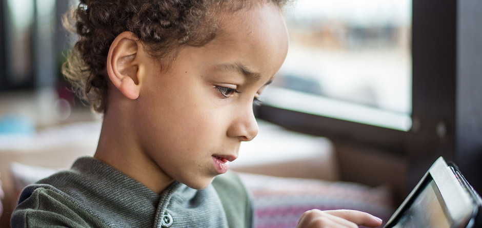 Boy Reading Tablet