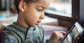 Boy Reading Tablet