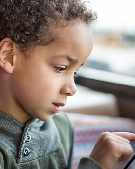 Boy Reading Tablet