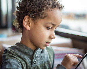 Boy Reading Tablet