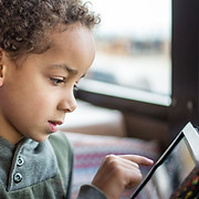 Boy Reading Tablet