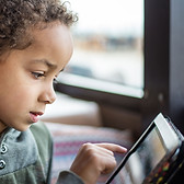 Boy Reading Tablet