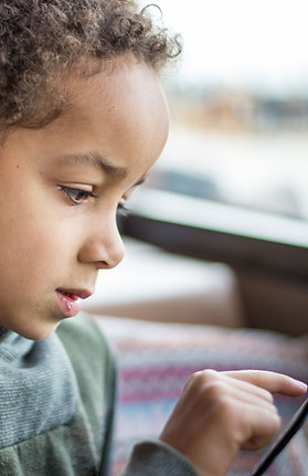 Boy Reading Tablet