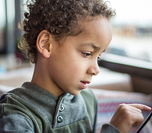 Boy Reading Tablet