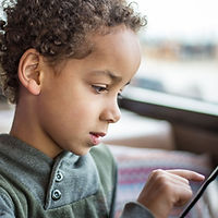 Boy Reading Tablet