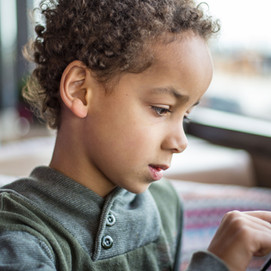 Boy Reading Tablet