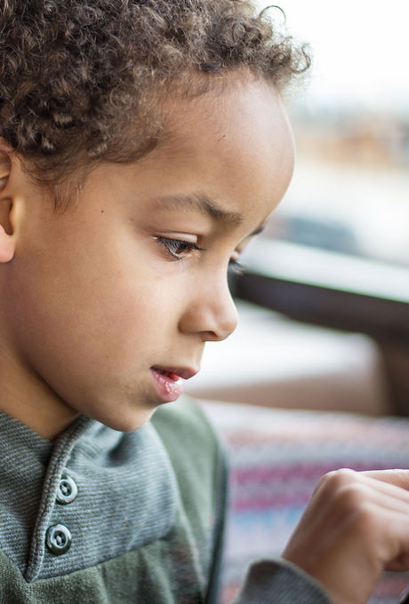 A Boy Reading on Tablet