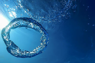 underwater-bubble-ring-ascends-towards-sun.jpg